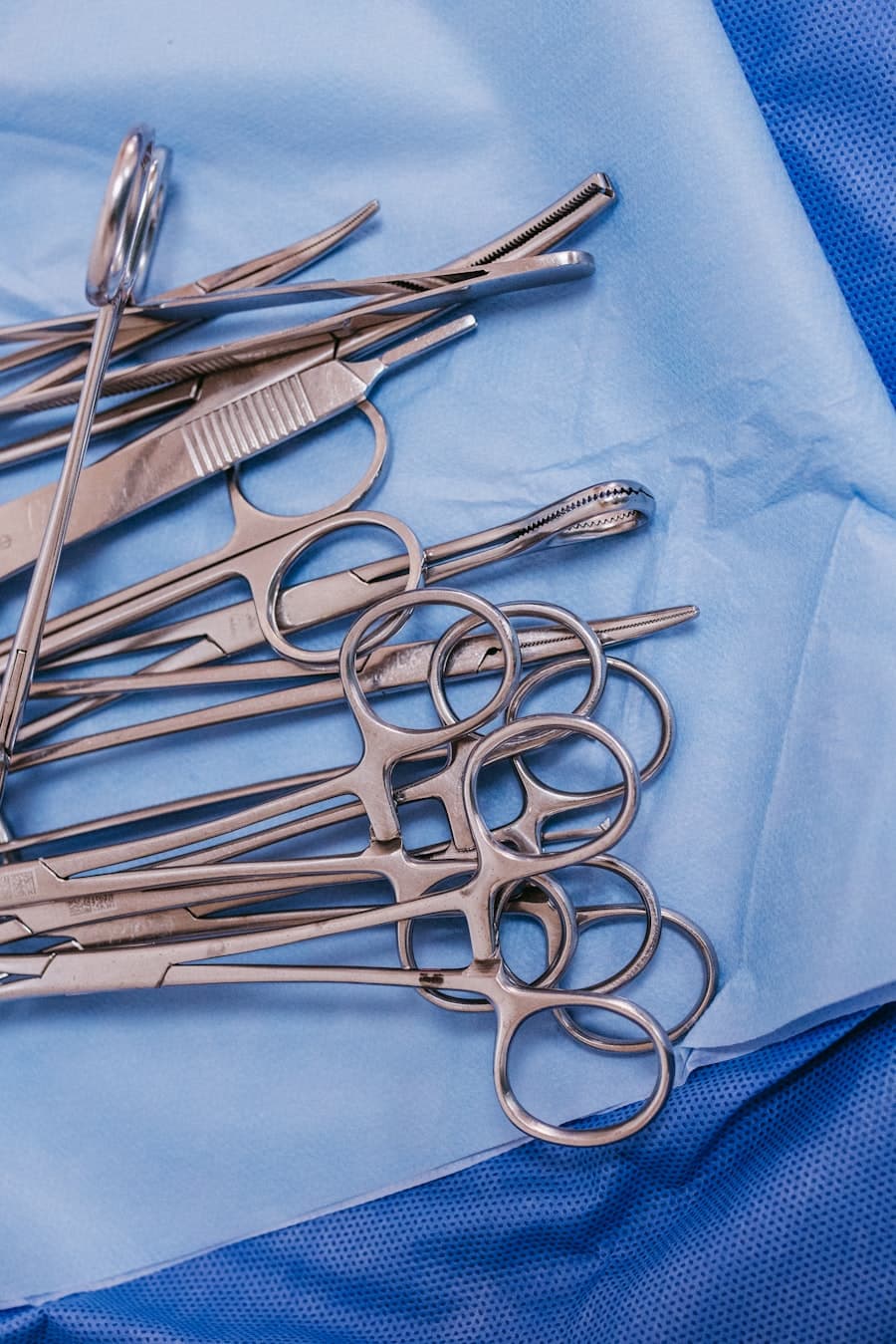 Fine surgical instruments laid out on a sterile cloth